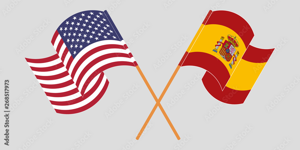 Crossed and waving flags of the USA and Spain Crossed and waving flags of the USA and Spain
