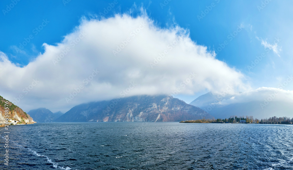 Mountain lake Traunsee with fog and clouds in Austria, Salzkammergut region.