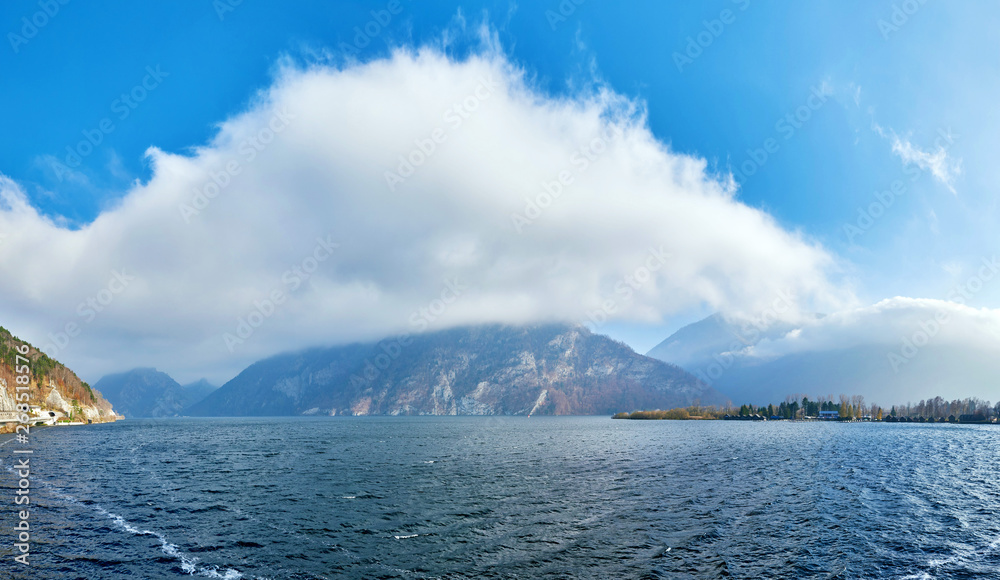 Mountain lake Traunsee with fog and clouds in Austria, Salzkammergut region. Mountain lake Traunsee with fog and clouds in Austria, Salzkammergut region.