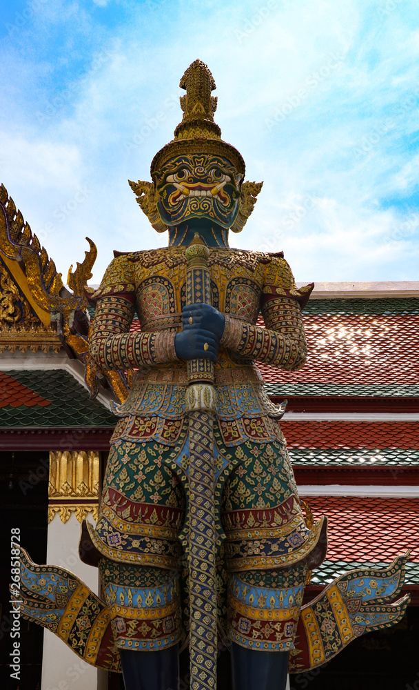 Wat Phra Kaew or Temple of Emerald Buddha, Guardian statues and Grand palace located within the grounds of the Grand Palace in Bangkok is Thailand’s most sacred temple and pilgrimage site for Thai