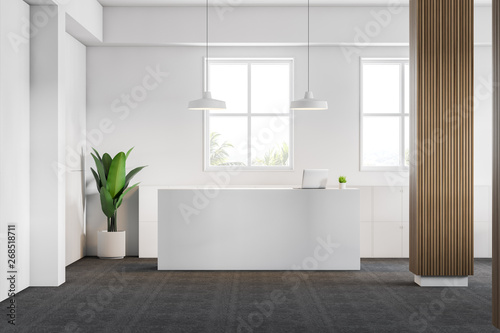 White office with column and reception desk