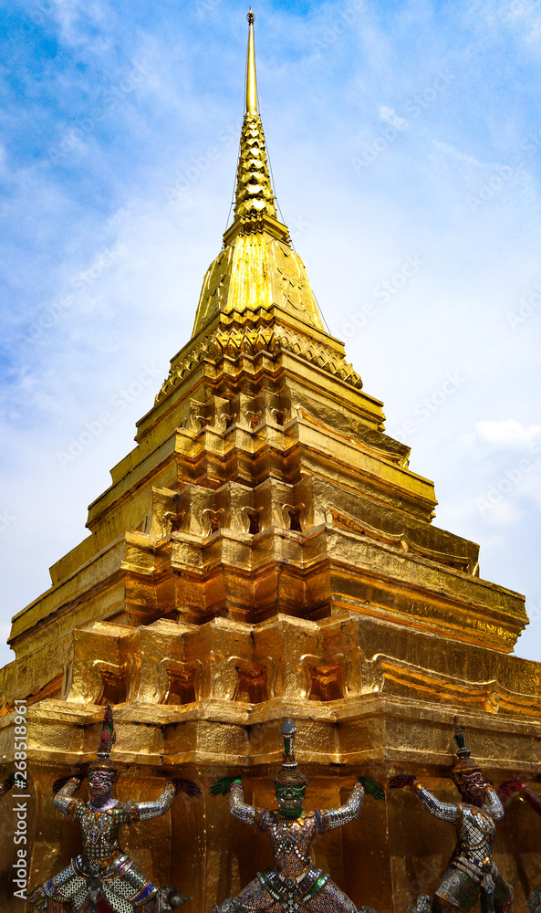 Fototapeta premium Wat Phra Kaew or Temple of Emerald Buddha, Guardian statues and Grand palace located within the grounds of the Grand Palace in Bangkok is Thailand’s most sacred temple and pilgrimage site for Thai