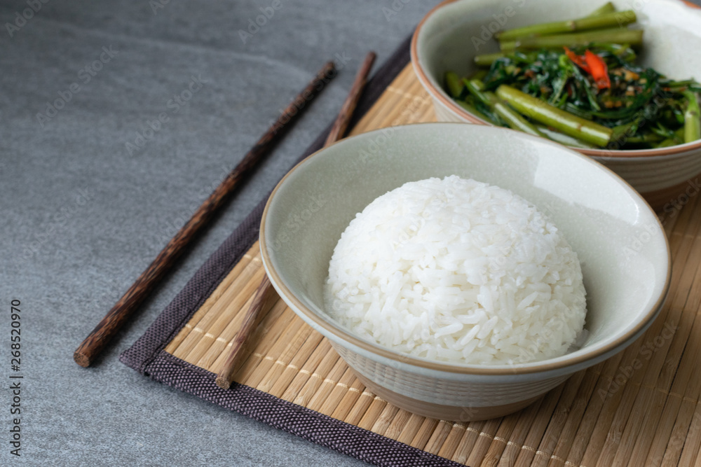 Fried morning glory with rice in gray bowl on table. Fried morning glory with rice in gray bowl on table.