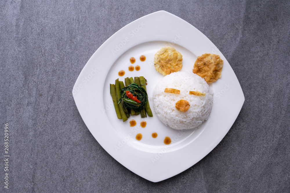 Fried morning glory with rice in gray bowl on table. Fried morning glory with rice in gray bowl on table.