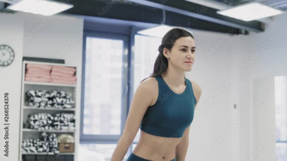 Group of women practicing yoga in commodious light studio Group of women practicing yoga in commodious light studio