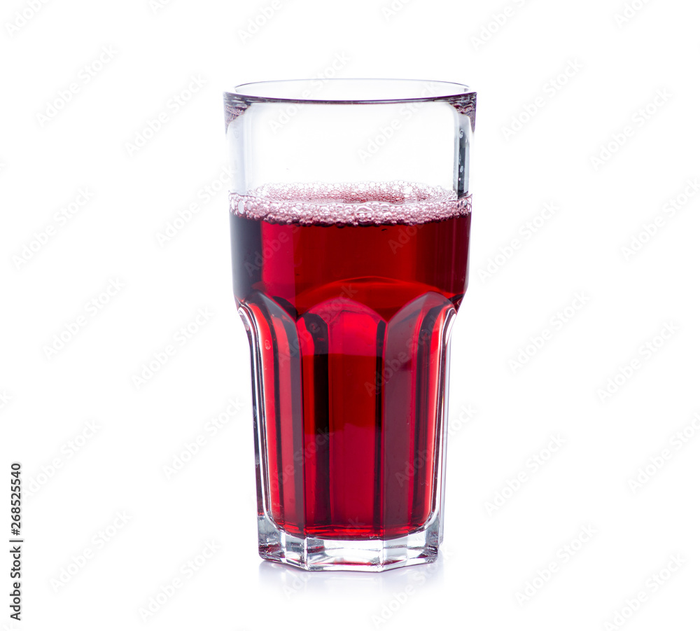 Cherry juice in a glass on white background isolation