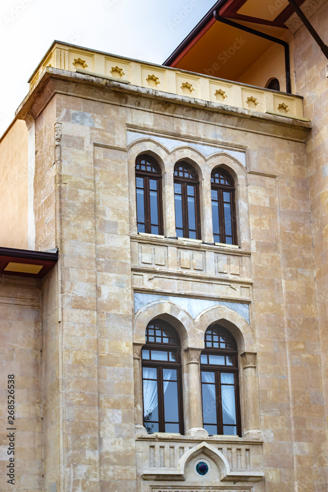 Clean shoot of stone masonry old government building facade with turkish architectural elements