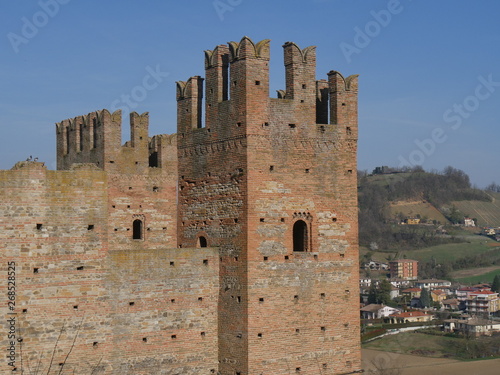 Visconti Castle in Castell'Arquato. Visconti Castle was the seat of the Visconti garrison and has a quadrangular plan with four towers, a mastio and a ditch with two entrances.  photo