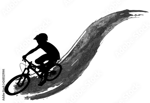 Silhouette of a cyclist riding a mountain bike