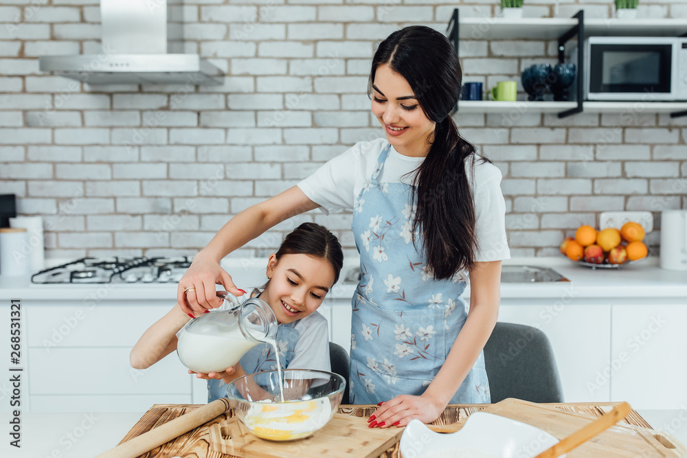 Home cooking to your soul. Little girl and her sister preparing home cooked food. Adorable cooks cooking delicious home cuisine. Lifestyle! Home cooking to your soul. Little girl and her sister preparing home cooked food. Adorable cooks cooking delicious home cuisine. Lifestyle!