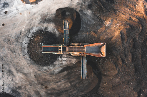 Aerial photo of a vibrating aggregate screen machine with 3 chutes from above, used for screening soil