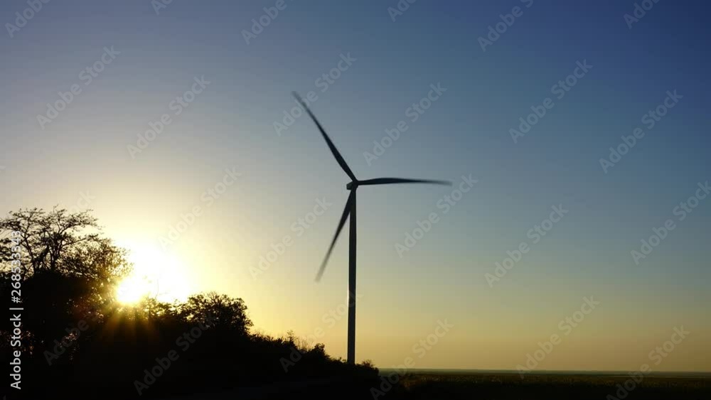 Windmill. Wind farm. Wind turbine. Shooting of Time lapse. Shooting at a sunset. Windmill. Wind farm. Wind turbine. Shooting of Time lapse. Shooting at a sunset.