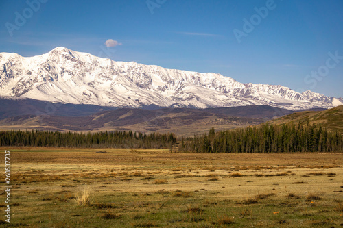 Mountain view with white snowy peaks and blue sky