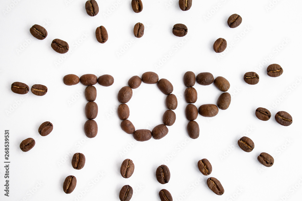 The inscription of coffee beans. Top White background The inscription of coffee beans. Top White background