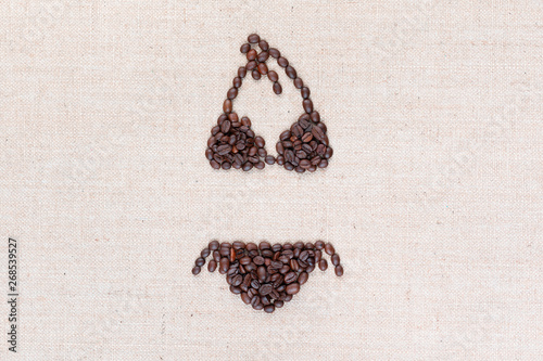 A bikini made with coffee beans shot from above, aligned in the center.