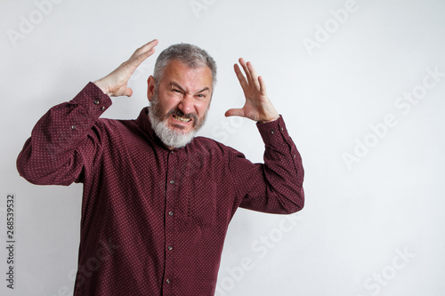 Closeup portrait of angry upset gray bearded man, worker, employee, business man hands in airion