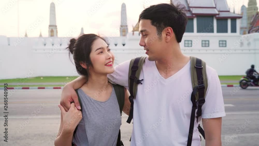 Traveler Asian couple feeling happy smiling to camera holiday trip at Bangkok, Thailand, backpacker Asia couple enjoy their journey at amazing landmark in traditional city. Portrait looking at camera. Traveler Asian couple feeling happy smiling to camera holiday trip at Bangkok, Thailand, backpacker Asia couple enjoy their journey at amazing landmark in traditional city. Portrait looking at camera.