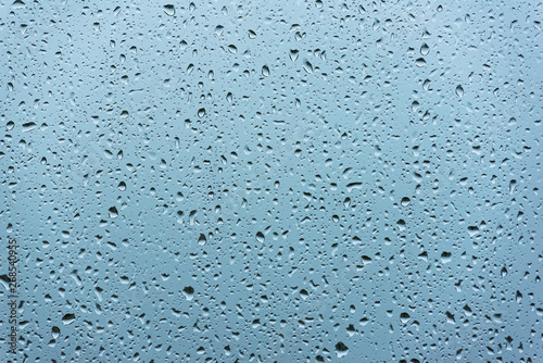 Background of water with water drops on glass