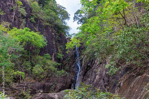 Waterfall, mountain spring water, stream between rocks and stones, brook, creek. Khlong Phlu, Thailand, island Koh Chang