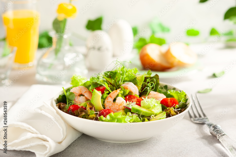 Fresh summer salad with shrimp, avocado and tomato
