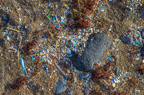 Micro plastics mixed in the sand of the beach