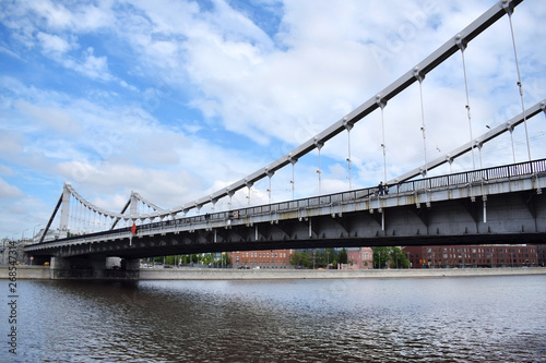 Moscow  Russia - May 13  2019  Crimean Bridge  Krymsky Most  across the Moskva river against the blue cloudy sky. The view from the embankment