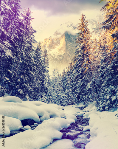 Winter wonderland in the Austrian alps. Majestic alpine mountain on the background. Dramatic scene. Natupe background. Retro Style. Instagram Filter © jenyateua