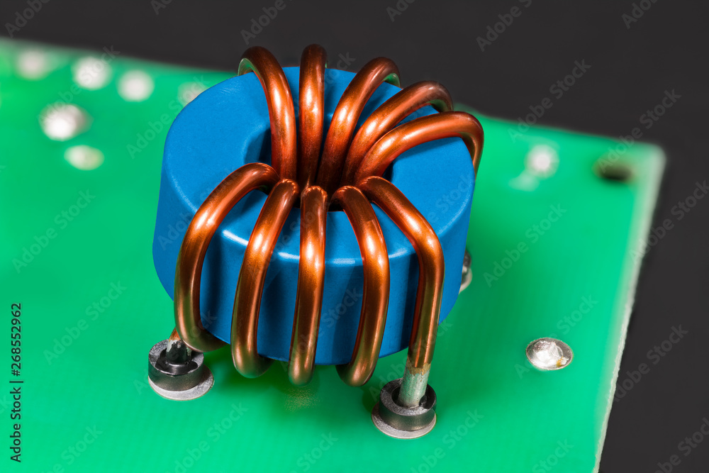 Blue inductor. ferrite core detail. Open electric device