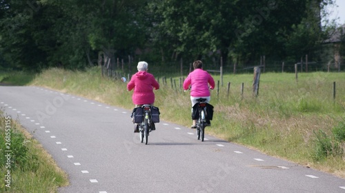 Wallpaper Mural couple riding a bicycle in the park Torontodigital.ca