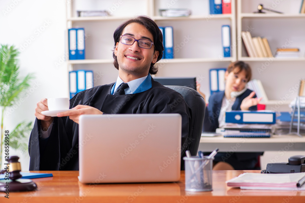 Two lawyers working in the office Two lawyers working in the office