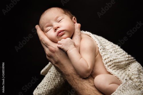 Newborn Baby on Father Hand, New Born Kid Sleeping in Man Hands, Parents Care Concept