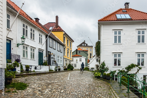 Small cobbled square in Bergen with typical Norwegian wooden buildings, Norway
