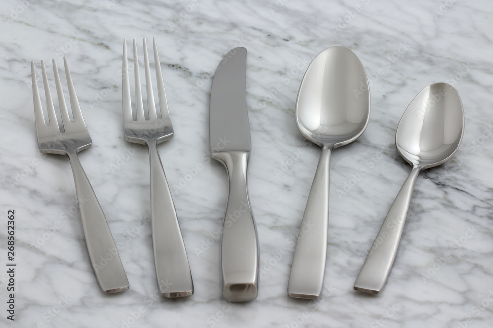 beautiful silverware on carrara marble beautiful silverware on carrara marble