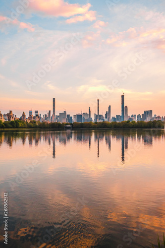 Sunset View of Manhattan skyline from Jacqueline Kennedy Onassis Reservoir in Central Park  reflection in water