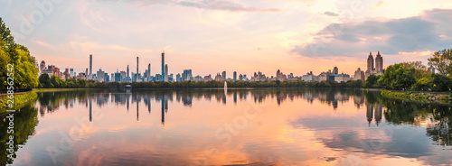 Sunset View of Manhattan skyline from Jacqueline Kennedy Onassis Reservoir in Central Park, reflection in water photo