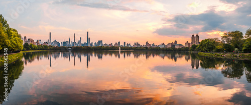 Sunset View of Manhattan skyline from Jacqueline Kennedy Onassis Reservoir in Central Park, reflection in water