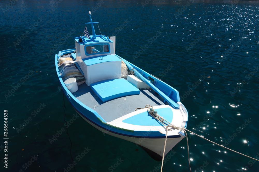 Fishing boat on a rope at the pier, Simi island. Fishing boat on a rope at the pier, Simi island.