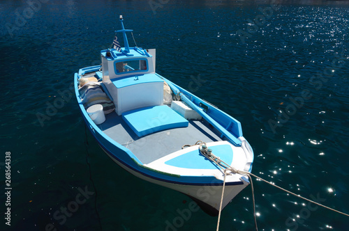 Fishing boat on a rope at the pier, Simi island.