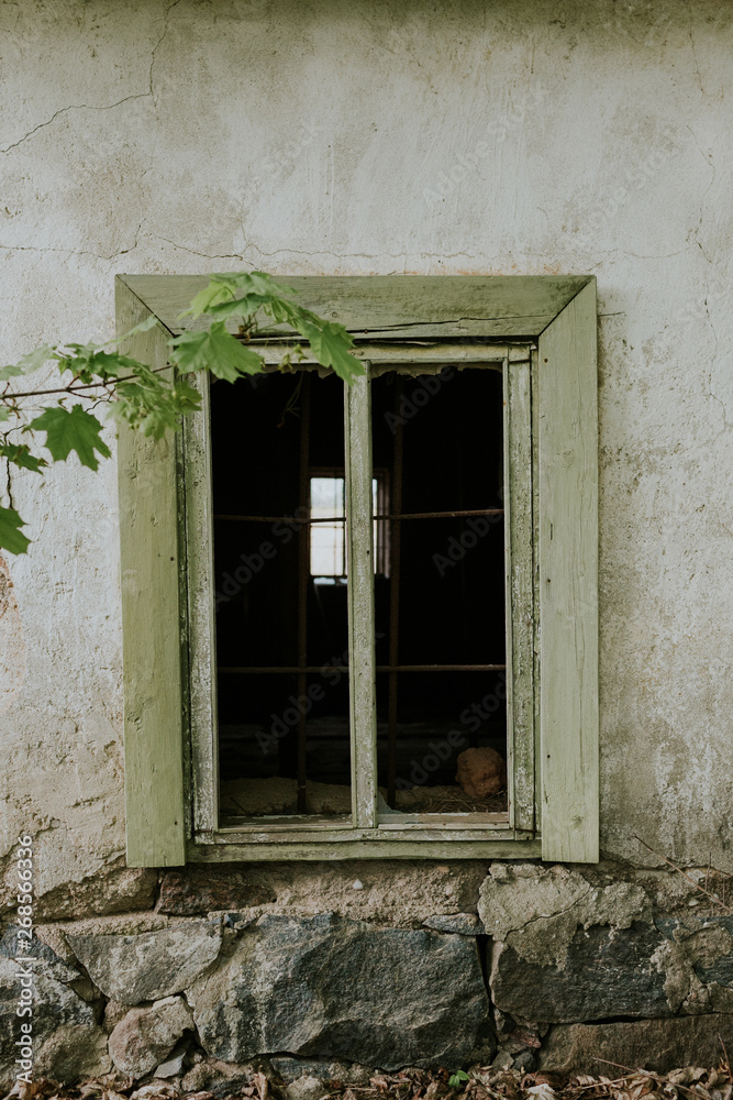 Old barn window with smashed glass