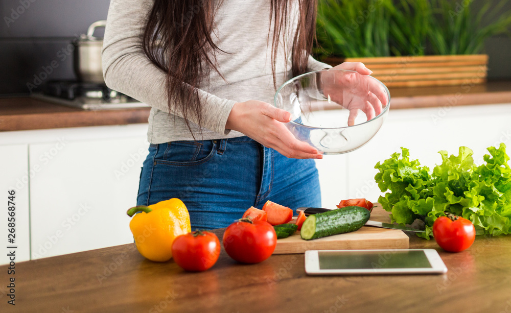 Young trendy woman cooking healthy food in the morning Young trendy woman cooking healthy food in the morning