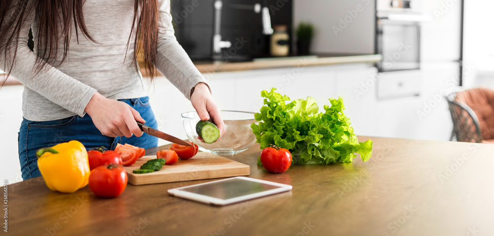 Young trendy woman cooking healthy food in the morning Young trendy woman cooking healthy food in the morning