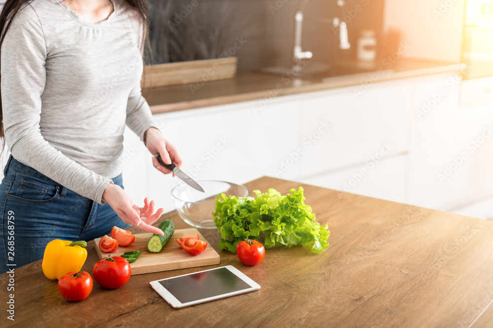 Young trendy woman cooking healthy food in the morning Young trendy woman cooking healthy food in the morning