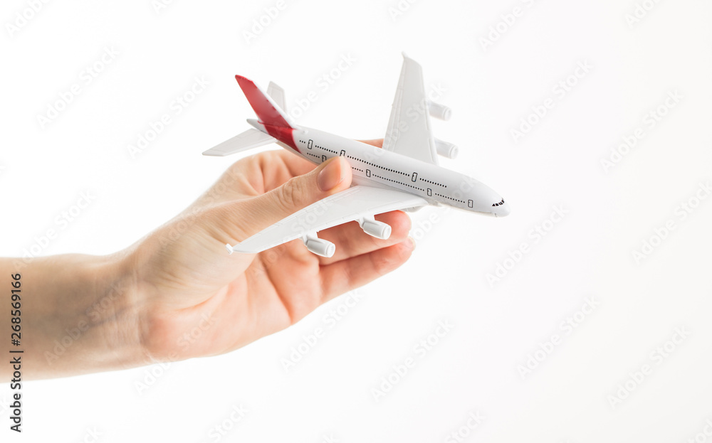 Hand with airplane on isolated background Hand with airplane on isolated background