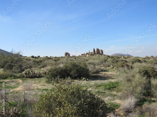View from Tom's Thumb in the McDowell Mountain range in the Sonoran desert near Scottsdale, Arizona, with a rocky landscape and blue sky 