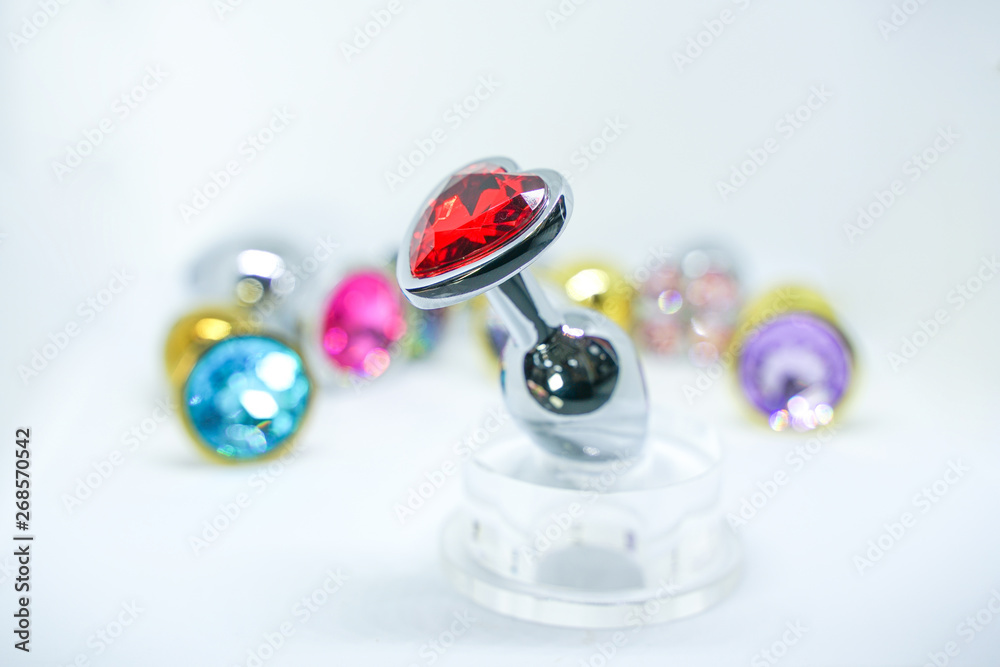 many anal plugs set. sex toys with crystals isolated on white background. many anal plugs set. sex toys with crystals isolated on white background.