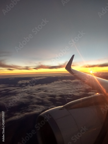 airplane flying above clouds