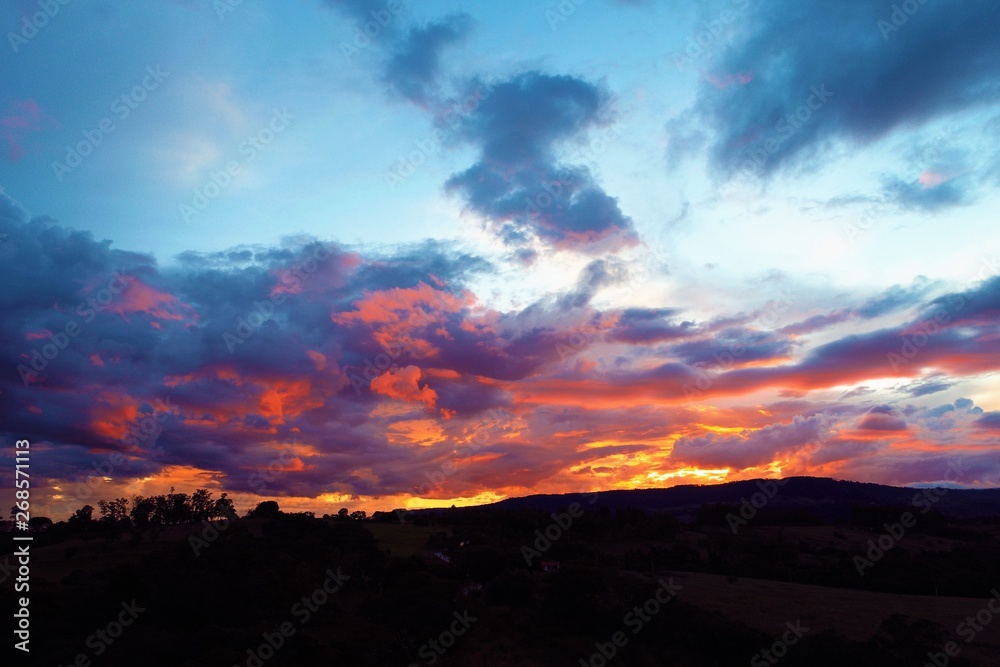 Sunset aerial view on countryside. Great landscape. Colored sky. Sunset aerial view on countryside. Great landscape. Colored sky.