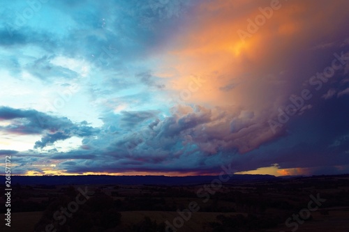 Sunset aerial view on countryside. Great landscape. Colored sky.