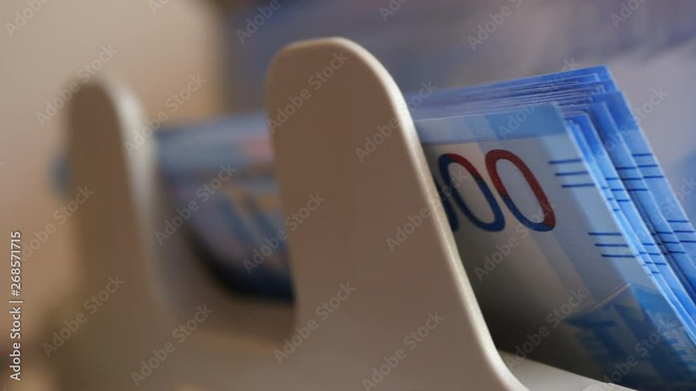 Counting Two Hundred Russian Rubles Banknotes On Currency Counter Machine Slider Shot. Counting Two Hundred Russian Rubles Banknotes On Currency Counter Machine Slider Shot.