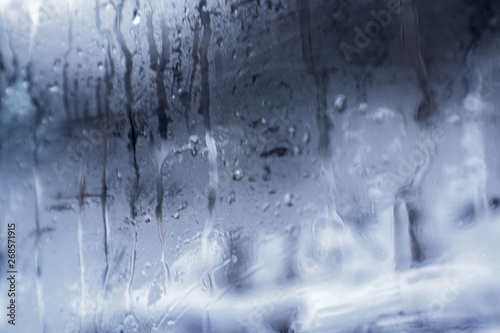 Glass with water drops as background